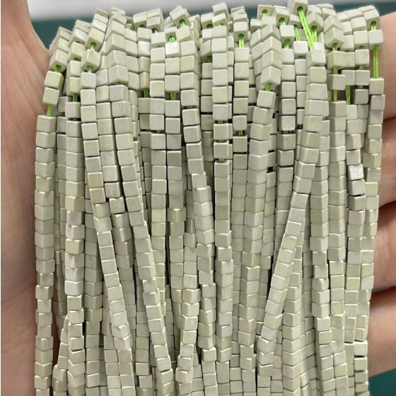 No_828_Synthetic Light Green Stone Small Cubes_2mm_(Sold Per Strand)